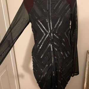 Black mini dress. Black mesh open back.